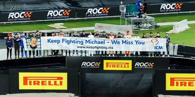 Schumacher tribute banner at the 2025 Race of Champions: Keep Fighting Michael – We Miss You